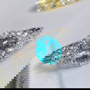 14K GOLD 2.30 CTW NATURAL PARAIBA TOURMALINE & DIAMOND RING: Ref:230652233 Gold Content:14K Gold Ring Size:7.25US Main Gemstone:Paraiba Tourmaline Number of stones:1 Shape:Oval Carat Weight:1.5ct Color:Neon Blue Treatment:Natural Cut Grade:G Adjacent Ge