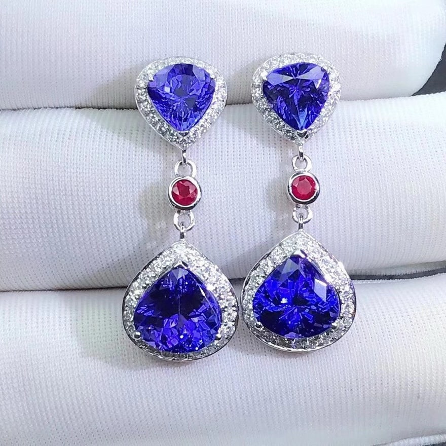 14K GOLD 6.54 CTW VIVID BLUE NATURAL TANZANITE & DIAMOND EARRINGS: Ref:230685096 Gold Content:14K Gold Main Gemstone:Tanzanite Number of stones:4 Shape:Pear Carat Weight:5.98ct Color:Vivid Blue Treatment:Natural Cut Grade:G Adjacent Gemstone 2 : Diamond Shape