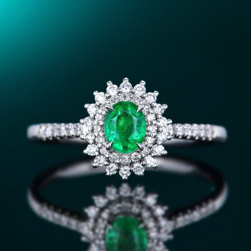 14K GOLD 0.67 CTW VIVID GREEN NATURAL EMERALD & DIAMOND RING: Ref:230728173 Gold Content:14K Gold Ring Size:7.25US Main Gemstone:Emerald Number of stones:1 Shape:Oval Carat Weight:0.37ct Color:Vivid Green Treatment:Natural Cut Grade:G Adjacent Gemstone 2