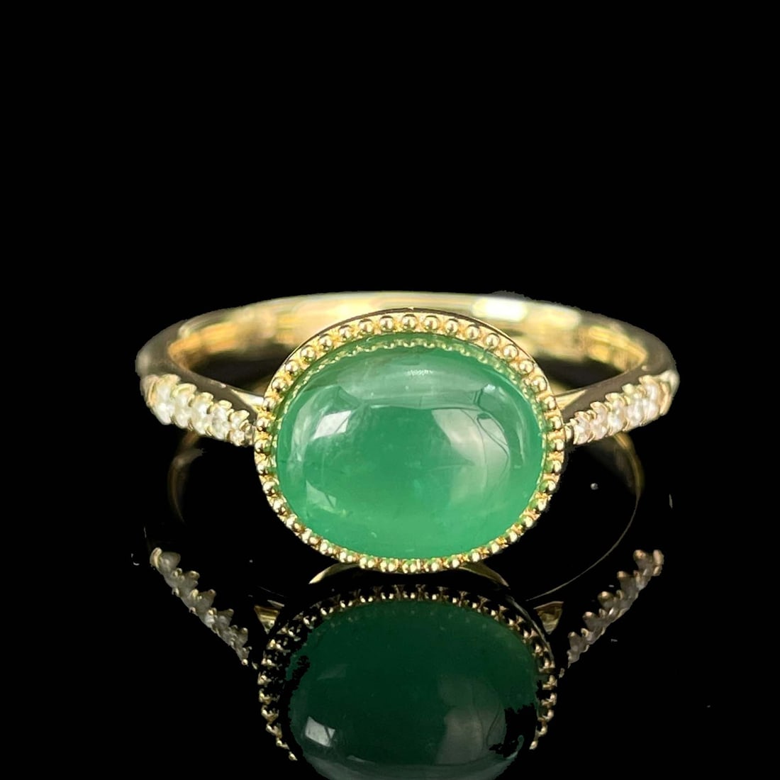 14K GOLD 2.37 CTW NATURAL EMERALD & DIAMOND RING: Ref:230779067 Gold Content:14K Gold Ring Size:7.25US Main Gemstone:Emerald Shape:Oval Carat Weight:2.32ct Color:Green Treatment:Natural Adjacent Gemstone 2 : Diamond Shape:Round Carat Weight:0