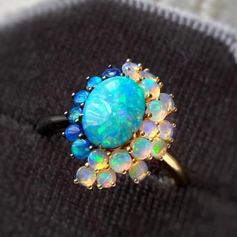 14K GOLD 1 CT NATURAL OPAL & OPAL RING: Ref:230791085 Gold Content:14K Gold Ring Size:7.25US Main Gemstone:Opal Shape:Oval Carat Weight:1ct Color:Color Treatment:Natural Adjacent Gemstone 2 : Opal Shape:Round Color:Color Treatme