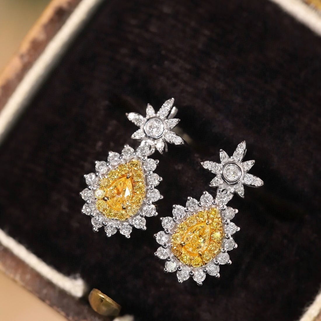 14K GOLD 0.60 CTW NATURAL YELLOW DIAMOND & DIAMOND EARRINGS: Ref:230798392 Gold Content:14K Gold Main Gemstone:Yellow Diamond Shape:Pear Carat Weight:0.18ct Color:Yellow Treatment:Natural Adjacent Gemstone 2 : Diamond Shape:Round Carat Weight:0.42ct Cl