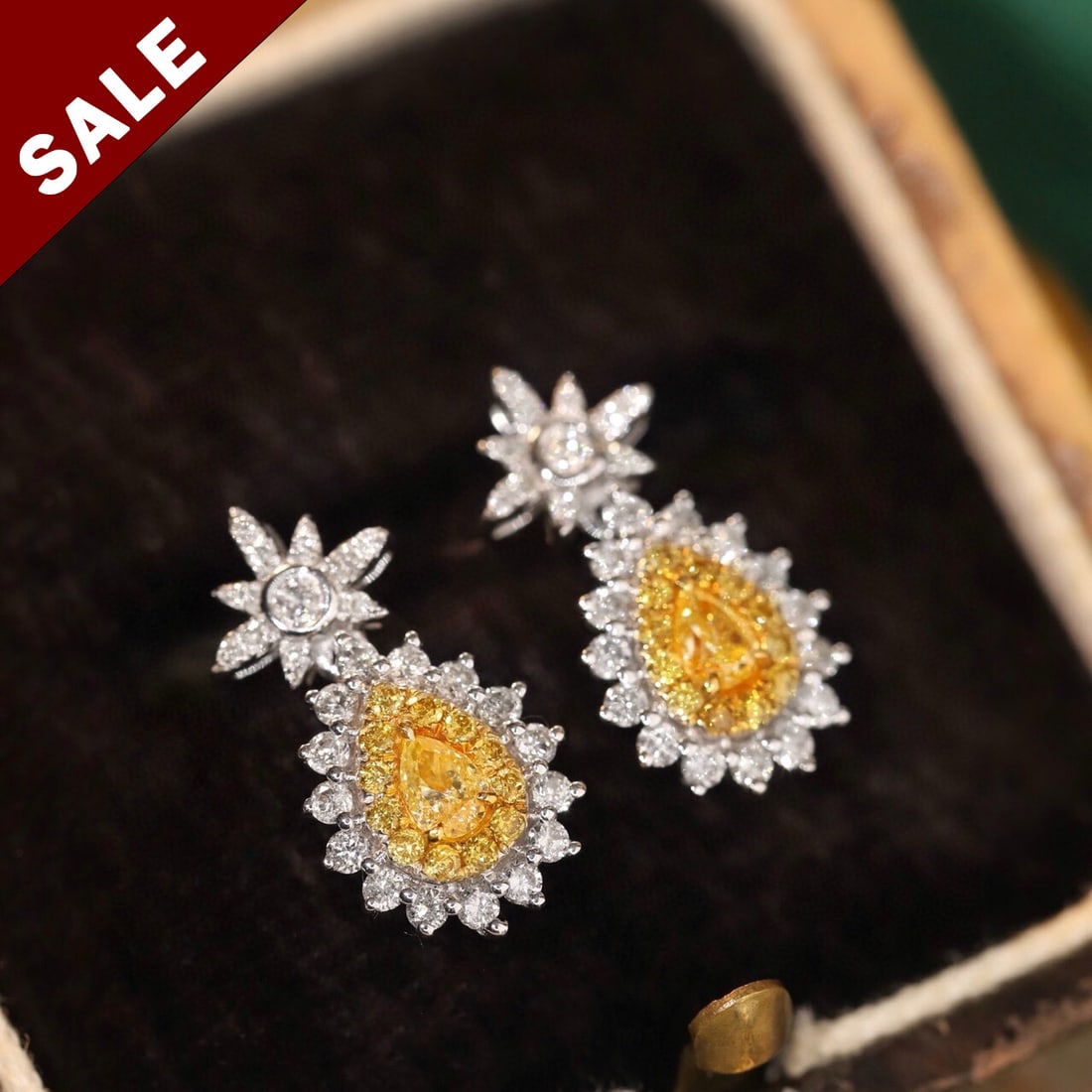 14K GOLD 0.60 CTW NATURAL YELLOW DIAMOND & DIAMOND EARRINGS: Ref:230798392 Gold Content:14K Gold Main Gemstone:Yellow Diamond Shape:Pear Carat Weight:0.18ct Color:Yellow Treatment:Natural Adjacent Gemstone 2 : Diamond Shape:Round Carat Weight:0.42ct Cl