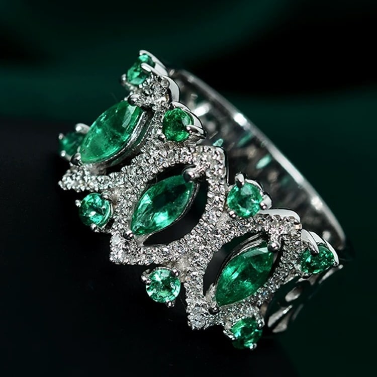 14K GOLD 1.34 CTW NATURAL EMERALD & DIAMOND RING: Ref:230831052 Gold Content:14K Gold Ring Size:7.25US Main Gemstone:Emerald Shape:Marquise Carat Weight:1.09ct Color:Green Treatment:Natural Adjacent Gemstone 2 : Diamond Shape:Round Carat Weig