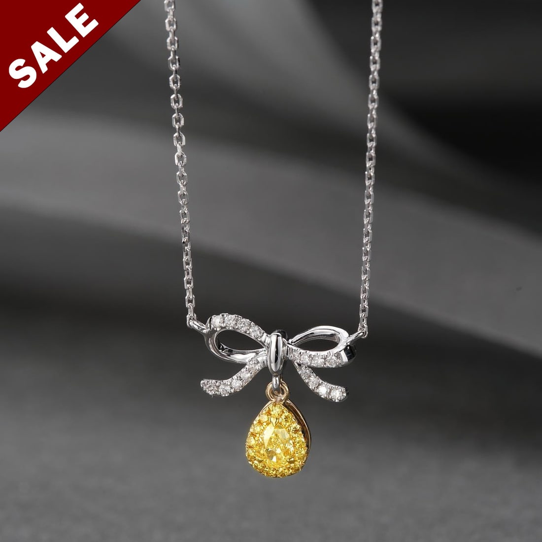14K GOLD 0.23 CTW NATURAL YELLOW DIAMOND & DIAMOND NECKLACE: Ref:230794035 Gold Content:14K Gold Main Gemstone:Yellow Diamond Shape:Pear Carat Weight:0.13ct Color:Yellow Treatment:Natural Adjacent Gemstone 2 : Diamond Shape:Round Carat Weight:0.10ct Cl