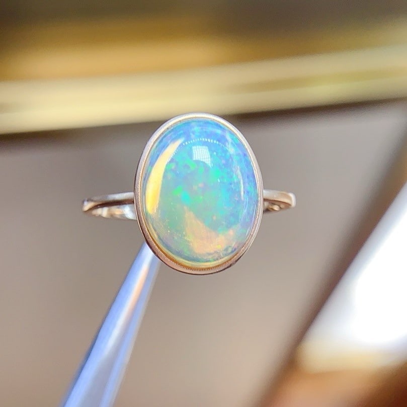 14K GOLD 4.2 CT NATURAL OPAL RING: Ref:230896002 Gold Content:14K Gold Ring Size:7.25US Main Gemstone:Opal Shape:Oval Carat Weight:4.2ct Color:Color Treatment:Natural