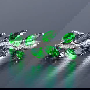 14K GOLD 1.48 CTW NATURAL TSAVORITE & DIAMOND RING: Ref:230909108 Gold Content:14K Gold Ring Size:7.25US Main Gemstone:Tsavorite Shape:Marquise Carat Weight:1.39ct Color:Green Treatment:Natural Adjacent Gemstone 2 : Diamond Number of stones:32