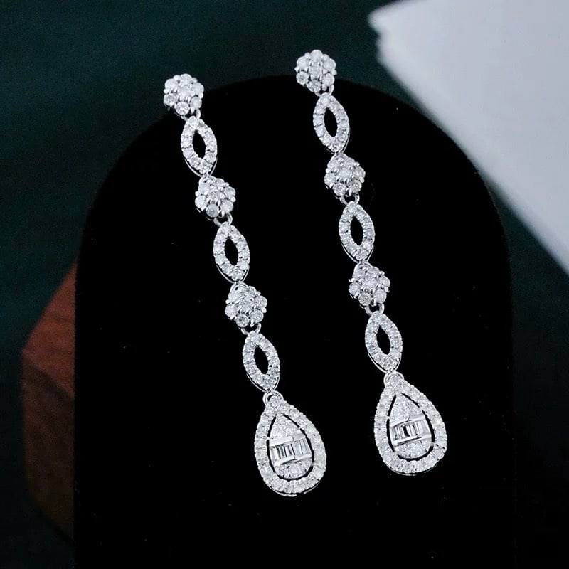 14k Gold 1 Ct Natural H Diamond Earrings: Ref:231007059 // gold content:14k gold // main gemstone:diamond // shape:multiply // carat weight:1ct // clarity grade:vs-si // color:h // treatment:natural // Condition: New Low Estimate: 2000.00 Hi