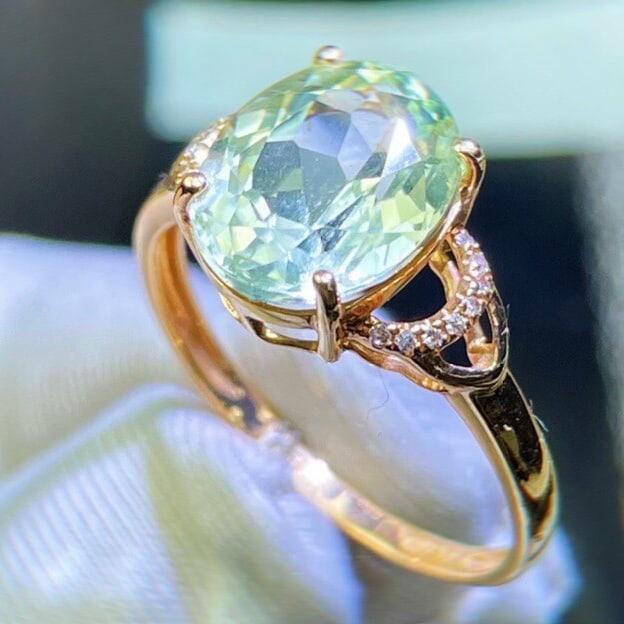 14k Gold 4 Ct Natural Tourmaline & Diamond Ring: Ref:231029235 // gold content:14k gold // ring size:7. 25us // // main gemstone:tourmaline // shape:oval // carat weight:4ct // color:green // treatment:natural // cut grade:g // // adjacent gemstone 