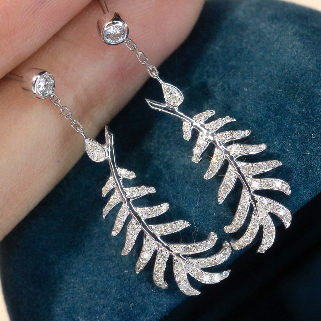 14k Gold 0.5 Ct Natural H Diamond Earrings: Ref:231030281 // gold content:14k gold // main gemstone:diamond // shape:round // carat weight:0. 5ct // clarity grade:vs-si // color:h // treatment:natural // cut grade:g // Condition: New Low Estima