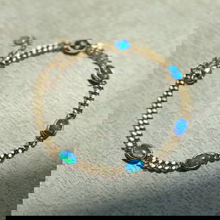 14k Gold 1.30 Ct Natural Opal Bracelet: Ref:230797054 // gold content:14k gold // main gemstone:opal // shape:oval // carat weight:1. 30ct // color:color // treatment:natural //  Condition: New Low Estimate: 2400.00 High Estimate: 3600.00