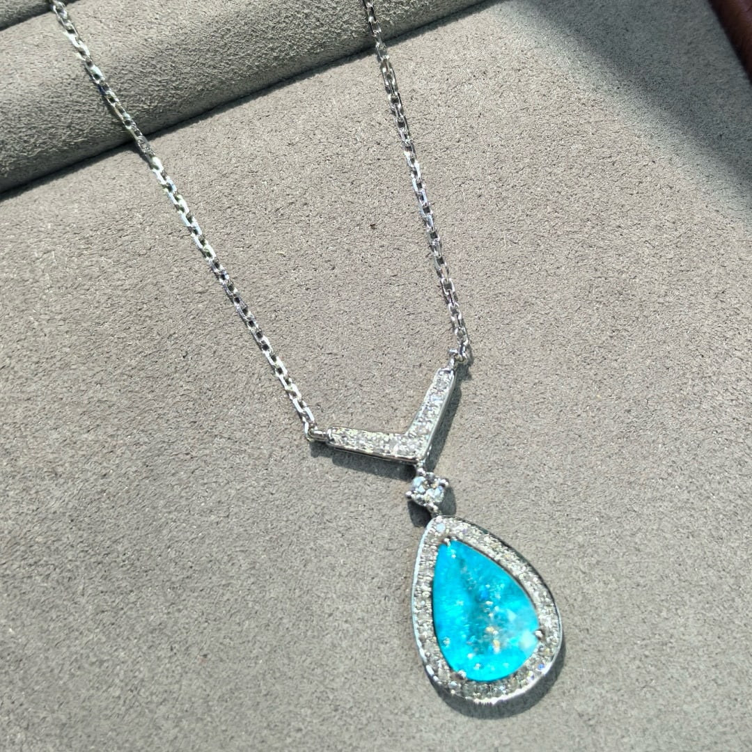 14k Gold 2.95 Ctw Natural Paraiba Tourmaline & Diamond Necklace: Ref:231069226 // gold content:14k gold // main gemstone:paraiba tourmaline // shape:pear // carat weight:2. 82ct // color:blue // treatment:natural // // adjacent gemstone 2 : diamond //