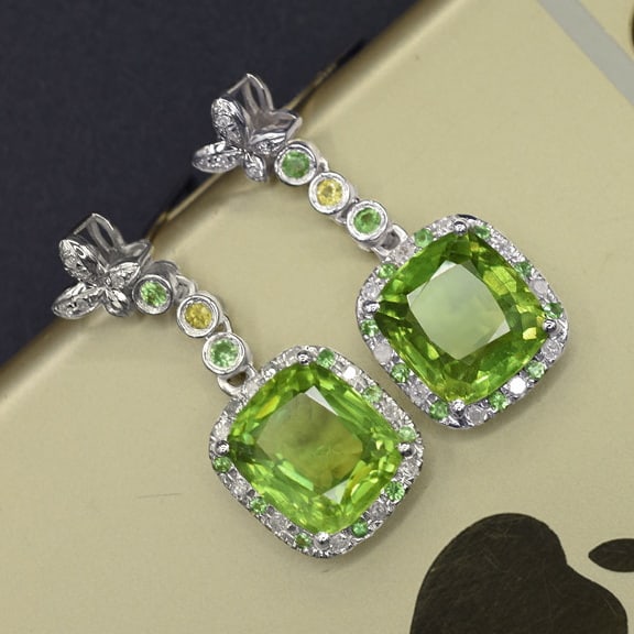 14k Gold 7.05 Ctw Natural Peridot & Diamond Earrings: Ref:231089050 // gold content:14k gold // main gemstone:peridot // shape:cushion // carat weight:6. 86ct // color:green // treatment:natural // // adjacent gemstone 2 : diamond // shape:round // carat