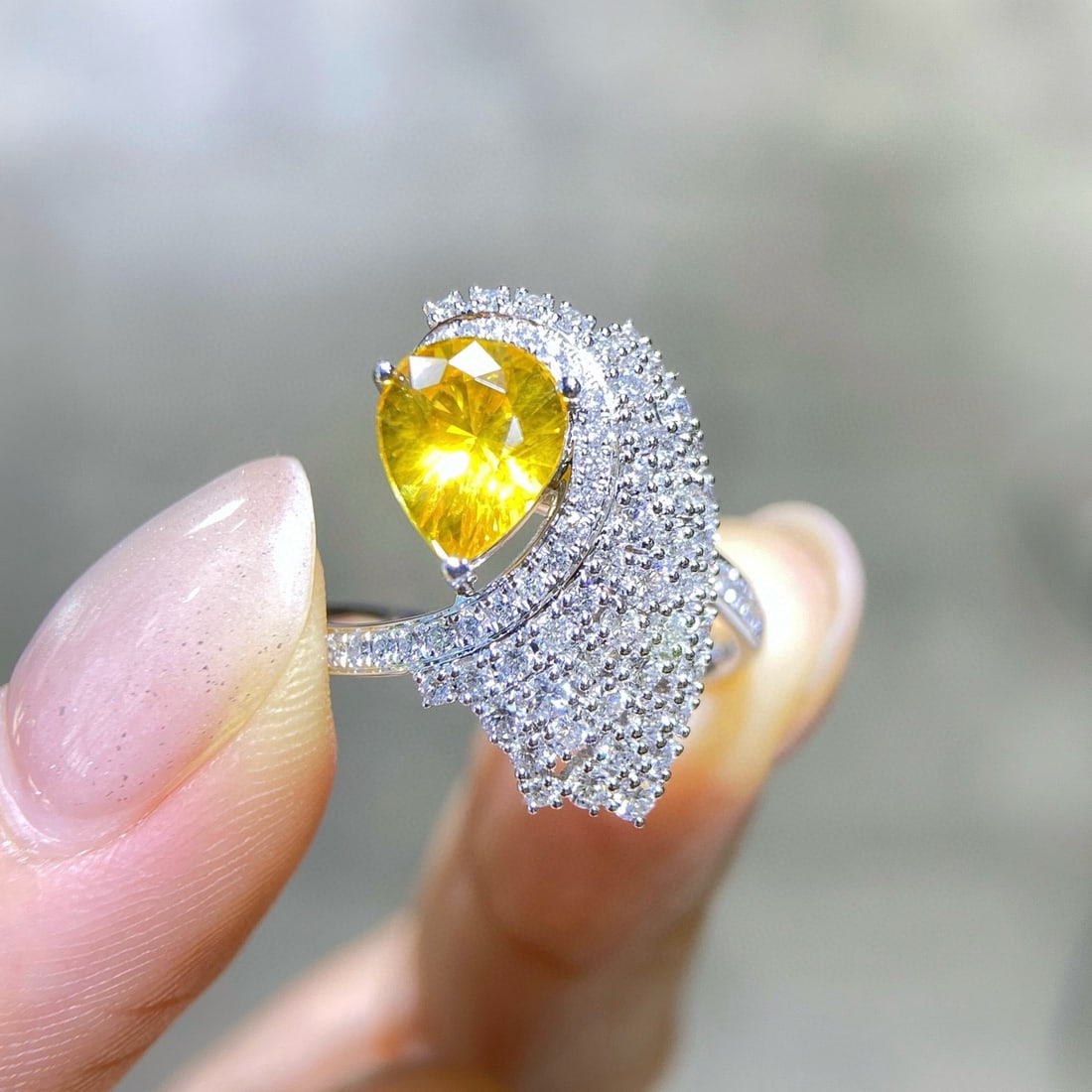 14k Gold 2.77 Ctw Natural Sapphire & Diamond Ring: Ref:231090414 // gold content:14k gold // ring size:7. 25us // // main gemstone:sapphire // shape:pear // carat weight:2. 02ct // color:yellow // treatment:natural // // adjacent gemstone 2 :