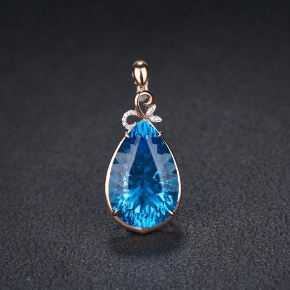 14K GOLD 26.79 CT NATURAL TOPAZ & DIAMOND PENDANT( WITHOUT CHAIN ): Ref:231102006 // Gold Content:14K Gold // Main Gemstone:Topaz // Shape:Pear // Carat Weight:26.79ct // Color:Blue // Treatment:Natural // // Adjacent Gemstone 2 : Diamond // Shape:Round // Clarity Gra