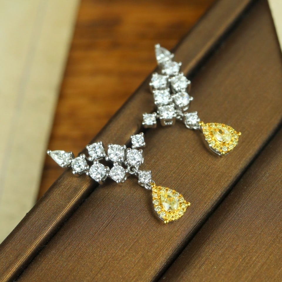 14K GOLD 1.42 CTW NATURAL YELLOW DIAMOND & DIAMOND EARRINGS: Ref:231102270 // Gold Content:14K Gold // Main Gemstone:Yellow Diamond // Shape:Pear // Carat Weight:0.22ct // Color:Yellow // Treatment:Natural // // Adjacent Gemstone 2 : Diamond //