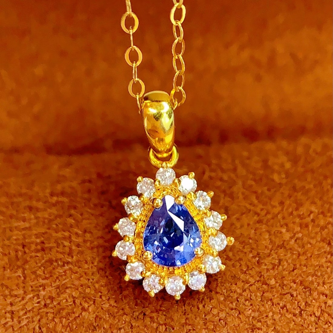 14K GOLD 0.4 CT NATURAL SAPPHIRE & DIAMOND PENDANT( WITHOUT CHAIN ): Ref:231102381 // Gold Content:14K Gold // Main Gemstone:Sapphire // Shape:Pear // Carat Weight:0.4ct // Color:Blue // Treatment:Natural // // Adjacent Gemstone 2 : Diamond // Number of stones:14 //