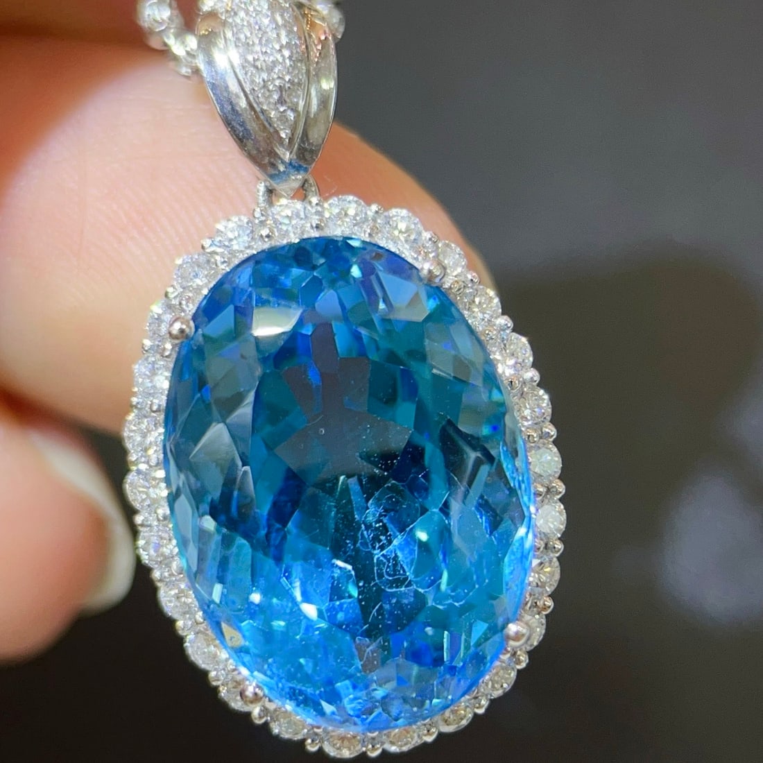 14K GOLD 18.24 CTW NATURAL TOPAZ & DIAMOND PENDANT( WITHOUT CHAIN ): Ref:231102422 // Gold Content:14K Gold // Main Gemstone:Topaz // Shape:Oval // Carat Weight:17.26ct // Color:Blue // Treatment:Natural // // Adjacent Gemstone 2 : Diamond // Shape:Round // Carat