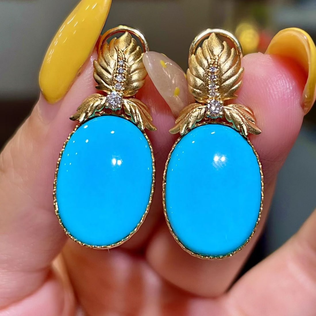 14K GOLD 14.96 CTW NATURAL BLUE TURQUOISE & DIAMOND EARRINGS: Ref:231102433 // Gold Content:14K Gold // Main Gemstone:Blue Turquoise // Shape:Oval // Carat Weight:14.81ct // Color:Blue // Treatment:Natural // // Adjacent Gemstone 2 : Diamond // Shape:Round // Ca