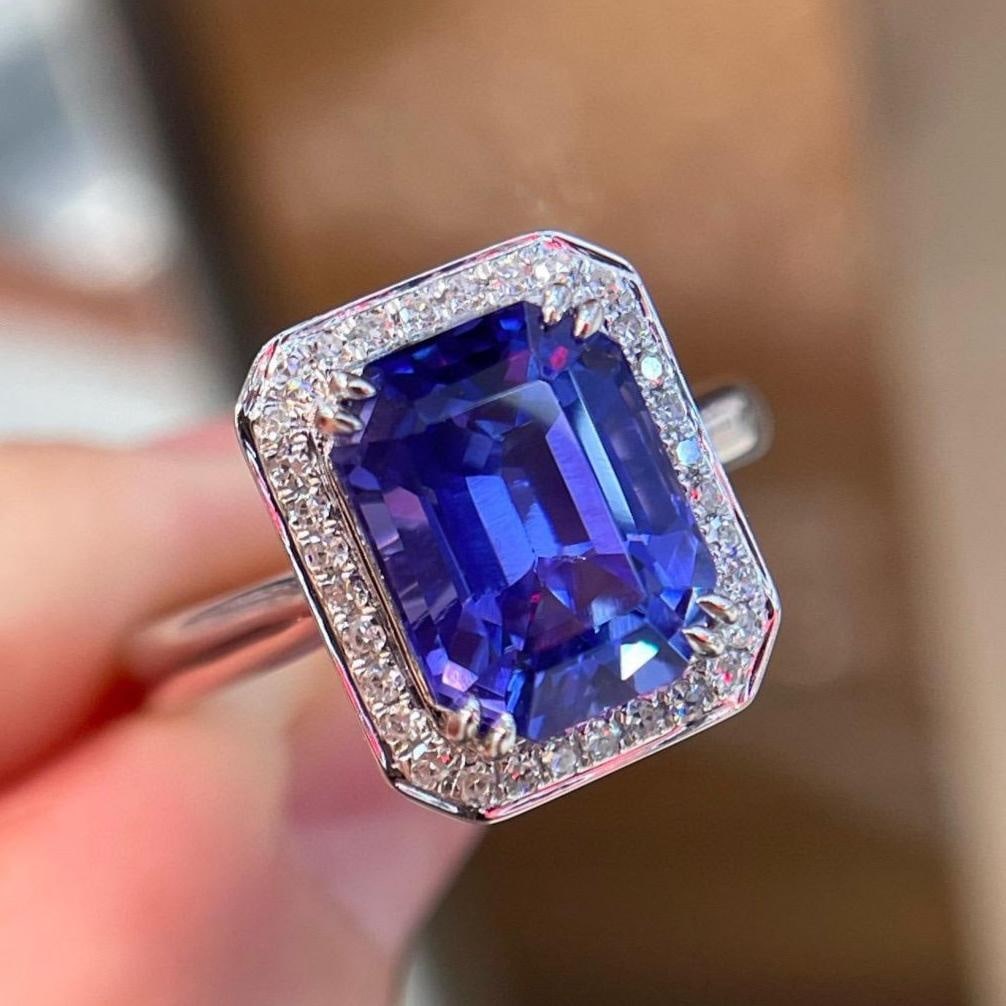 14k Gold 4.56 Ctw Natural Tanzanite & Diamond Ring: Ref:231103013 // gold content:14k gold // ring size:7. 25us // // main gemstone:tanzanite // shape:octagonal // carat weight:4. 40ct // color:blue // treatment:natural // // adjacent gemstone 2 :