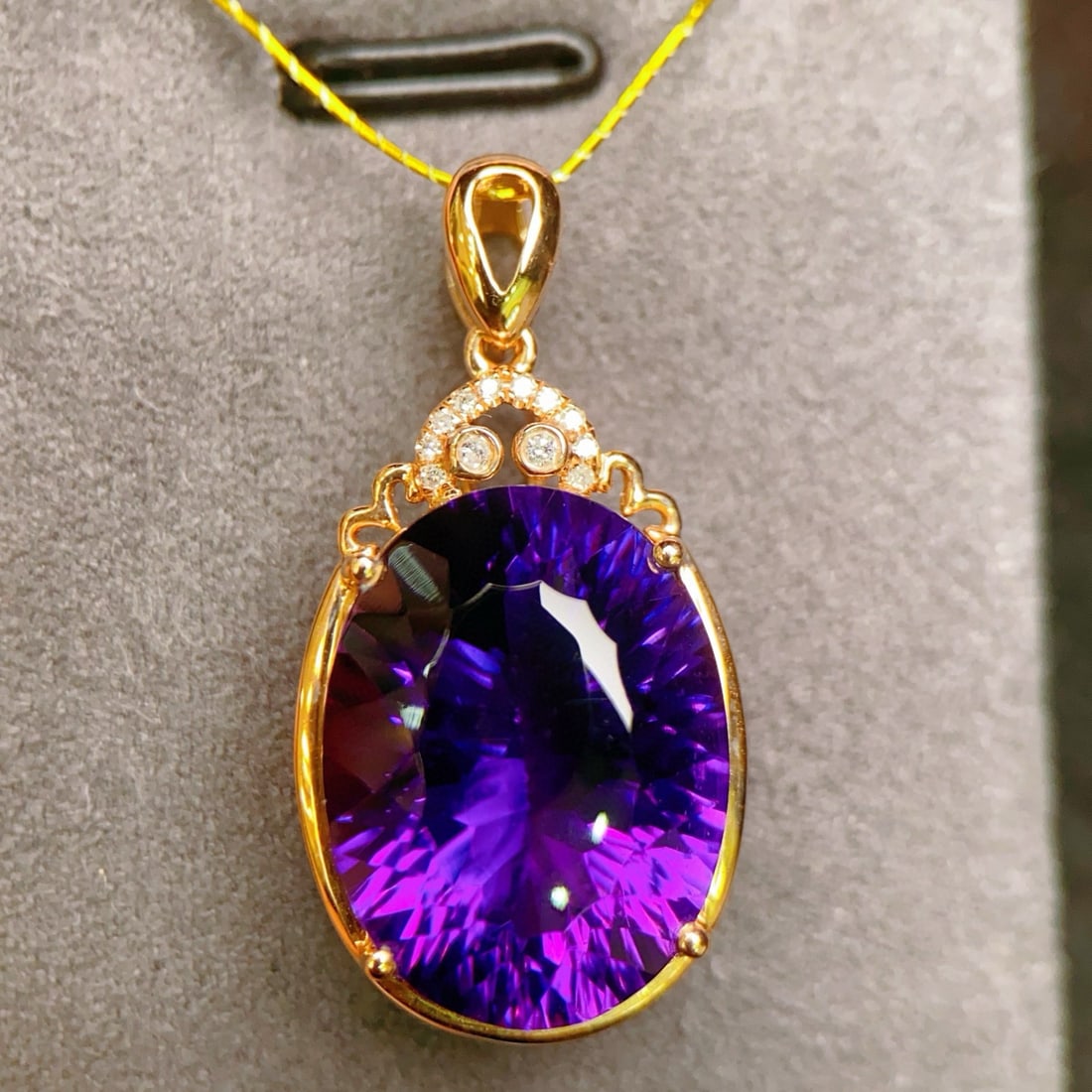 14k Gold 9.04 Ctw Natural Amethyst & Diamond Pendant( Without Chain ): Ref:231103138 // gold content:14k gold // main gemstone:amethyst // shape:oval // carat weight:9ct // color:purple // treatment:natural // // adjacent gemstone 2 : diamond // number of stones:12 // sh