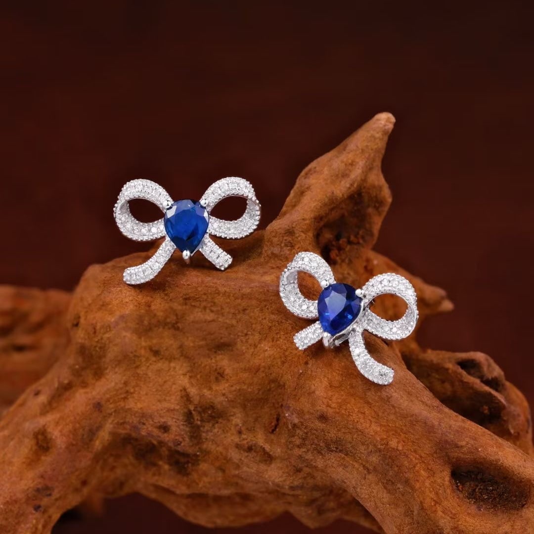 14k Gold 0.92 Ctw Natural Sapphire & Diamond Earrings: Ref:231103157 // gold content:14k gold // main gemstone:sapphire // shape:pear // carat weight:0. 8ct // color:blue // treatment:natural // // adjacent gemstone 2 : diamond // shape:round // carat