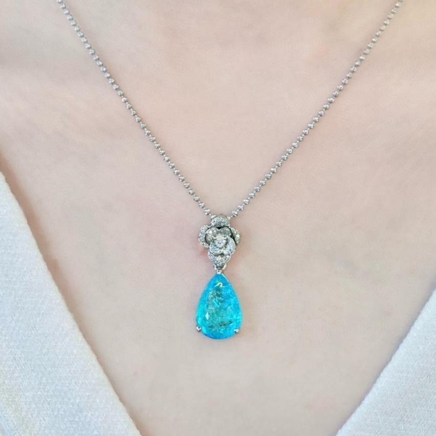 14k Gold 2.30 Ctw Natural Paraiba Tourmaline & Diamond Pendant( Without Chain ): Ref:231103168 // gold content:14k gold // main gemstone:paraiba tourmaline // shape:pear // carat weight:2. 15ct // color:blue // treatment:natural // // adjacent gemstone 2 : diamond //