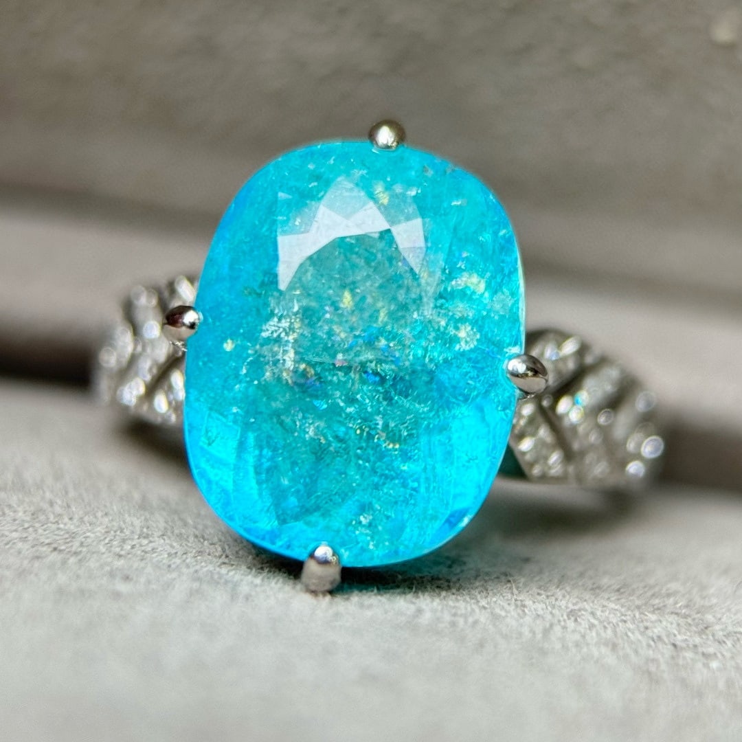 14k Gold 7.89 Ctw Natural Paraiba Tourmaline & Diamond Ring: Ref:231103212 // gold content:14k gold // ring size:7. 25us // // main gemstone:paraiba tourmaline // shape:cushion // carat weight:7. 75ct // color:blue // treatment:natural // // adjacent