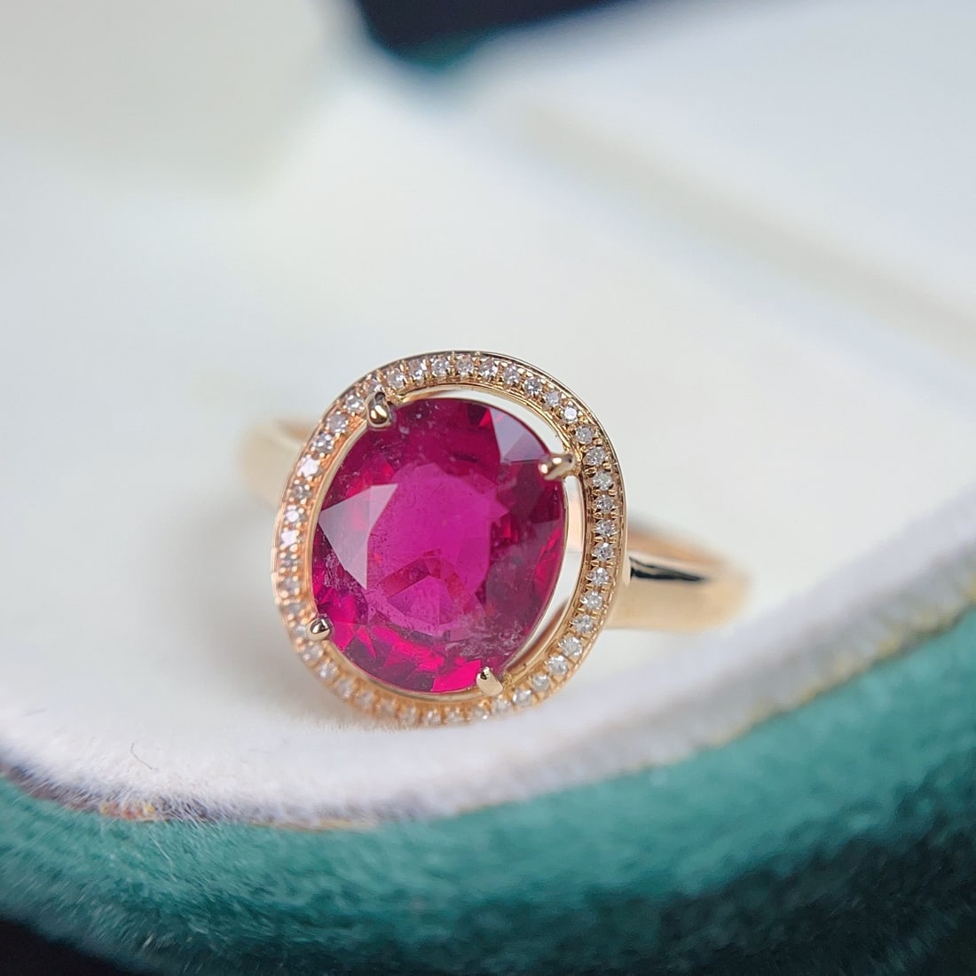 14k Gold 2.80 Ct Natural Tourmaline & Diamond Ring: Ref:231104299 // gold content:14k gold // ring size:7. 25us // // main gemstone:tourmaline // shape:oval // carat weight:2. 80ct // color:red // treatment:natural // // adjacent gemstone 2 :