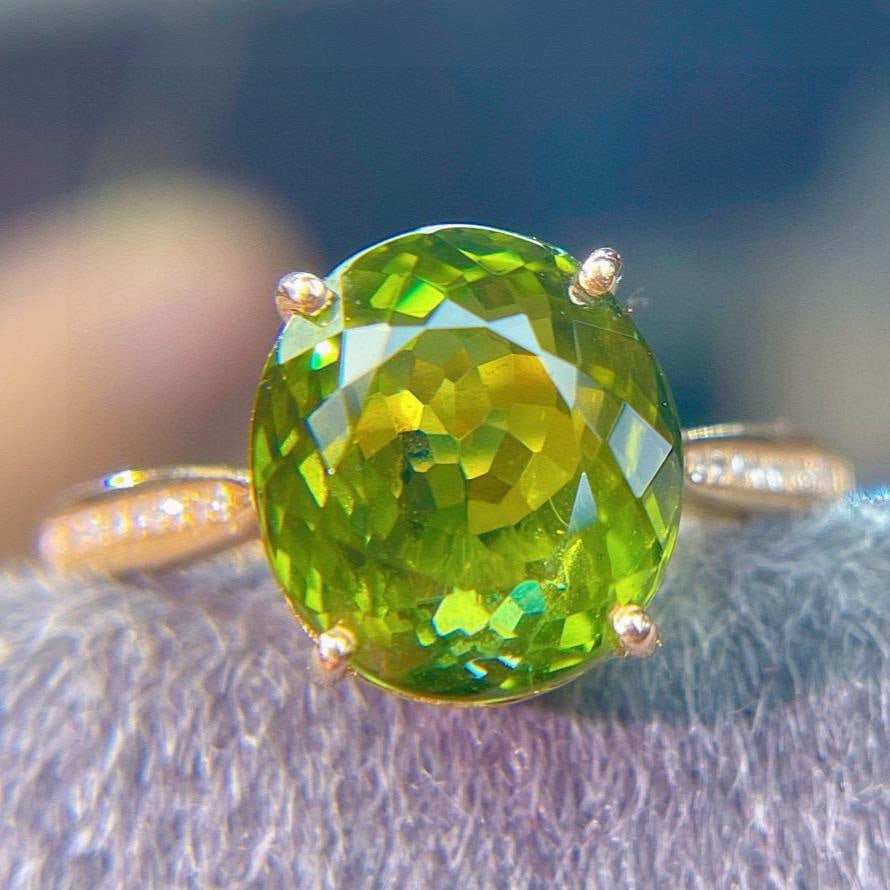 14k Gold 5.75 Ct Natural Tourmaline & Diamond Ring: Ref:231113055 // gold content:14k gold // ring size:7. 25us // // main gemstone:tourmaline // shape:oval // carat weight:5. 75ct // color:green // treatment:natural // // adjacent gemstone 2 : diamond