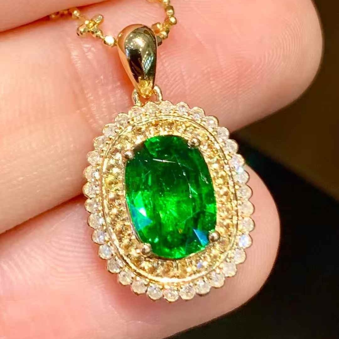 14k Gold 1.55 Ct Natural Tsavorite & Diamond Pendant( Without Chain ): Ref:231113181 // gold content:14k gold // main gemstone:tsavorite // shape:oval // carat weight:1. 55ct // color:green // treatment:natural // // adjacent gemstone 2 : diamond // shape:round //