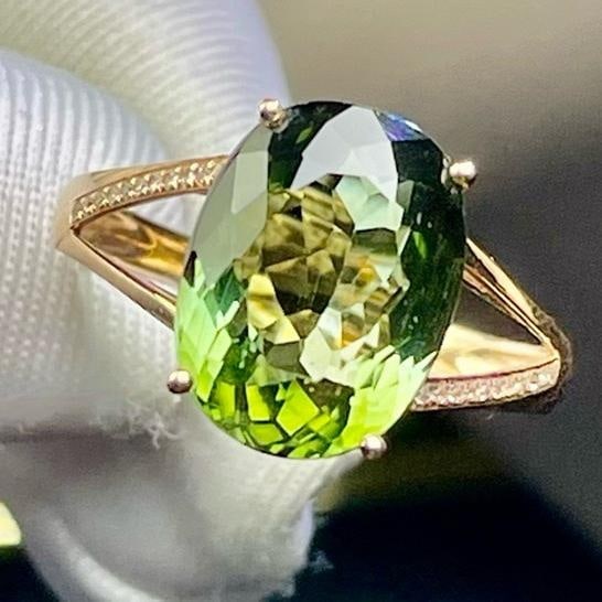 14k Gold 6.25 Ct Natural Tourmaline & Diamond Ring: Ref:231113231 // gold content:14k gold // ring size:7. 25us // // main gemstone:tourmaline // shape:oval // carat weight:6. 25ct // color:green // treatment:natural // // adjacent gemstone 2 : diamond
