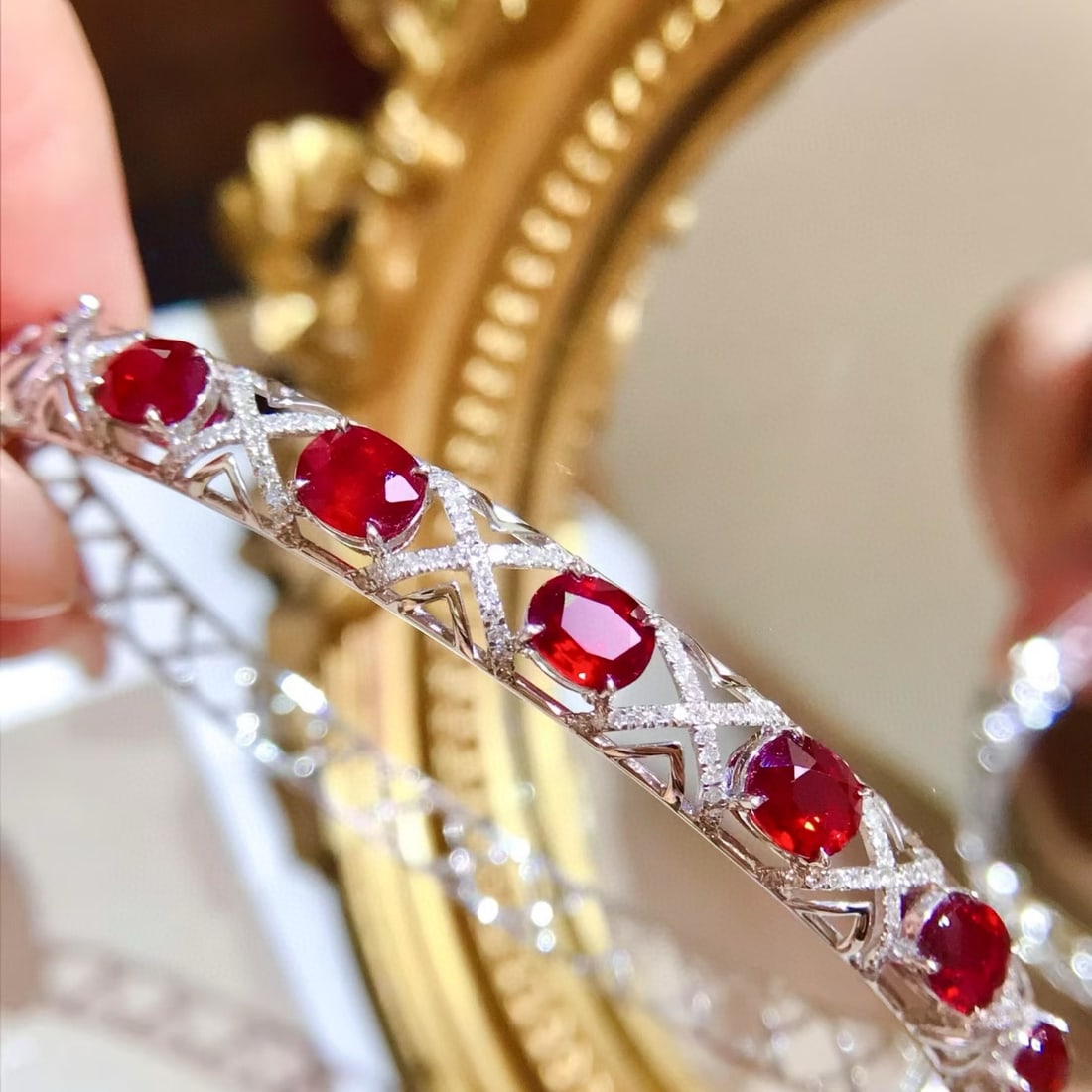 14k Gold 4.73 Ctw Natural Ruby & Diamond Bangle: Ref:231113243 // gold content:14k gold // main gemstone:ruby // shape:oval // carat weight:4. 1ct // color:red // treatment:natural // // adjacent gemstone 2 : diamond // shape:round // carat weight:0
