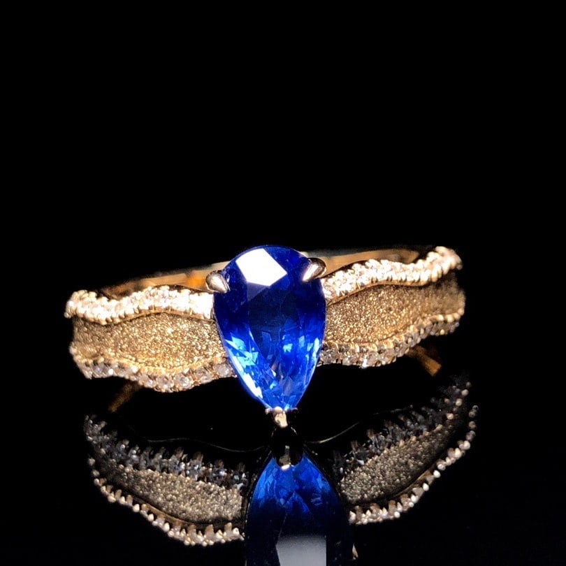 14k Gold 1.43 Ctw Natural Sapphire & Diamond Ring: Ref:231114030 // gold content:14k gold // ring size:7. 25us // // main gemstone:sapphire // shape:pear // carat weight:1. 24ct // color:royal blue // treatment:natural // // adjacent gemstone 2 :