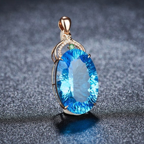 14k Gold 22.88 Ct Natural Topaz & Diamond & Tsavorite Pendant( Without Chain ): Ref:231114245 // gold content:14k gold // main gemstone:topaz // shape:oval // carat weight:22. 88ct // color:blue // treatment:natural // // adjacent gemstone 2 : diamond // shape:round // clarity gr