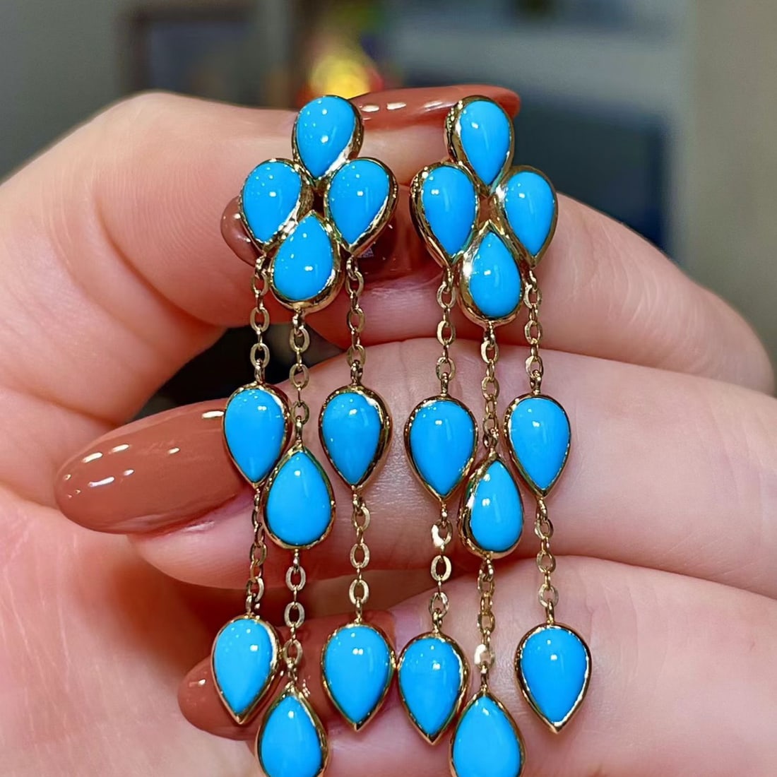 14k Gold 8.0 Ct Natural Blue Turquoise Earrings: Ref:231114402 // gold content:14k gold // main gemstone:blue turquoise // shape:pear // carat weight:8. 0ct // color:blue // treatment:natural // Condition: NewLow Estimate: 4600.00High Estimate: