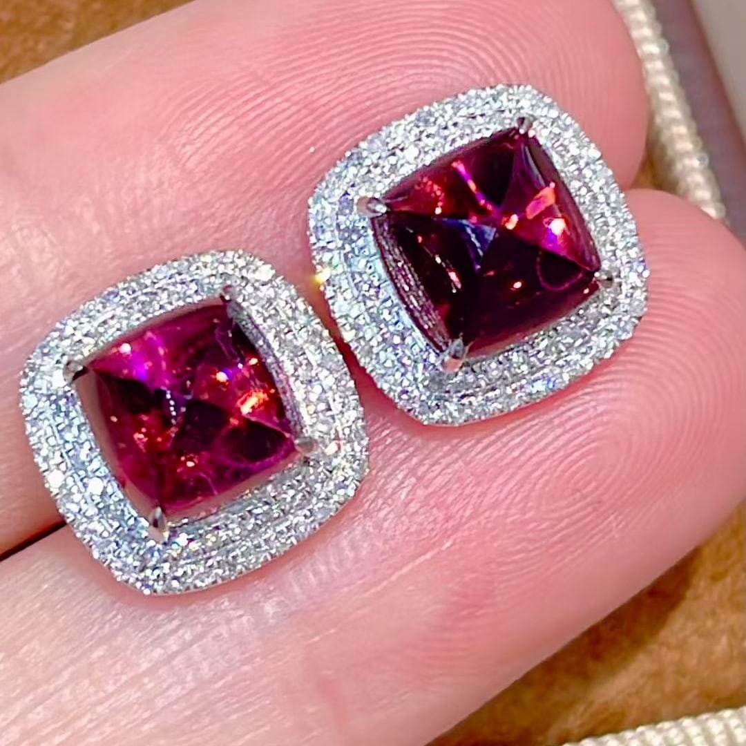 14k Gold 4.15 Ct Natural Tourmaline & Diamond Earrings: Ref:231105136 // gold content:14k gold // main gemstone:tourmaline // shape:sugar-loaf // carat weight:4. 15ct // color:red // treatment:natural // // adjacent gemstone 2 : diamond // shape:round