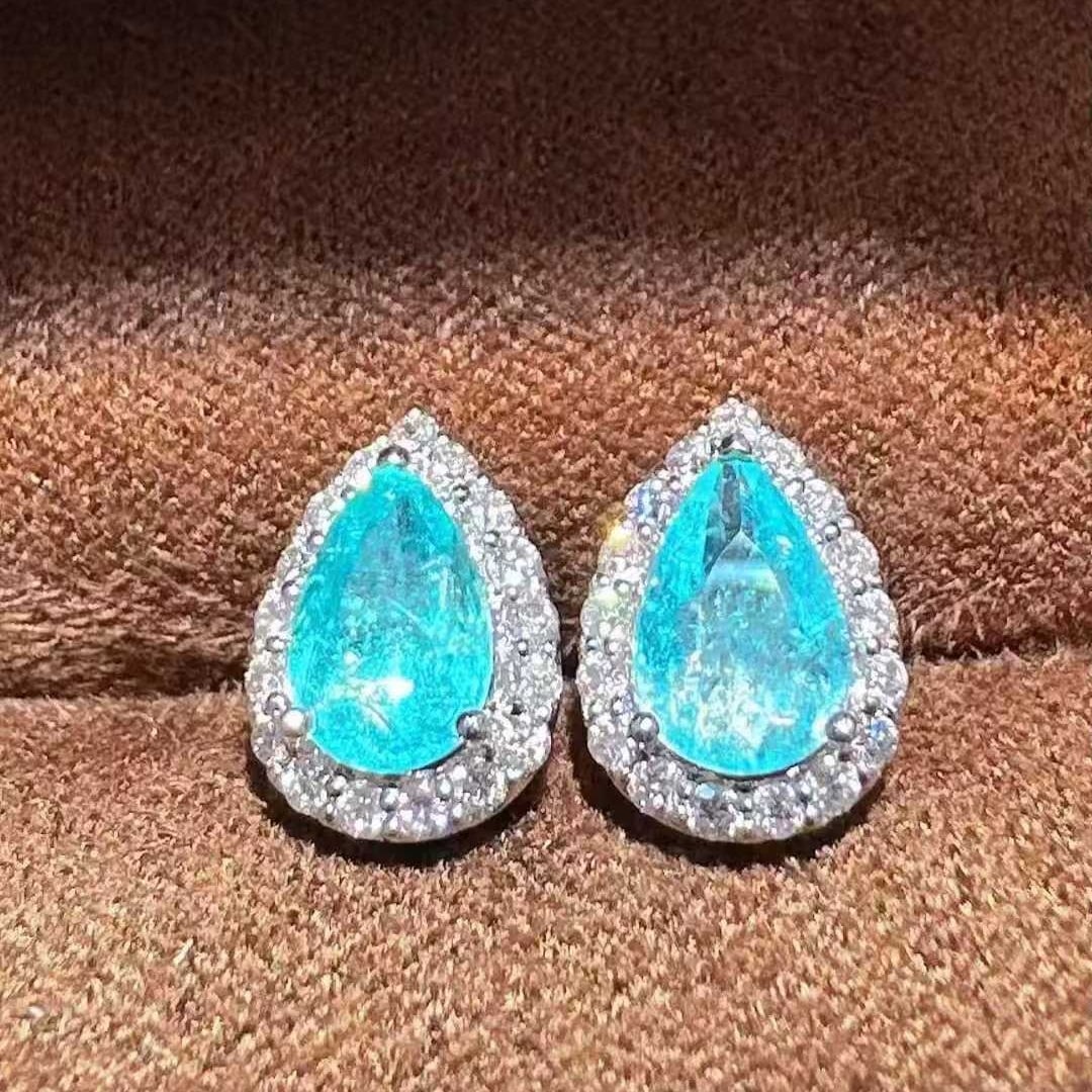 14k Gold 1.65 Ctw Natural Paraiba Tourmaline & Diamond Earrings: Ref:231105207 // gold content:14k gold // main gemstone:paraiba tourmaline // shape:pear // carat weight:1. 31ct // color:blue // treatment:natural // // adjacent gemstone 2 : diamond //