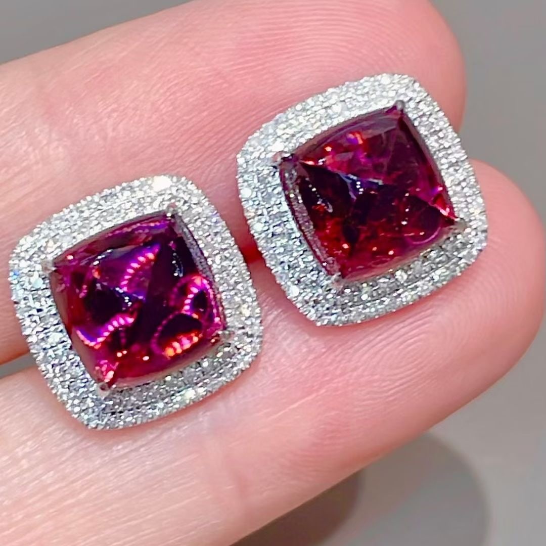 14k Gold 7.00 Ct Natural Tourmaline & Diamond Earrings: Ref:231105213 // gold content:14k gold // main gemstone:tourmaline // shape:sugar-loaf // carat weight:7. 00ct // color:purplish red // treatment:natural // // adjacent gemstone 2 : diamond // shape:r