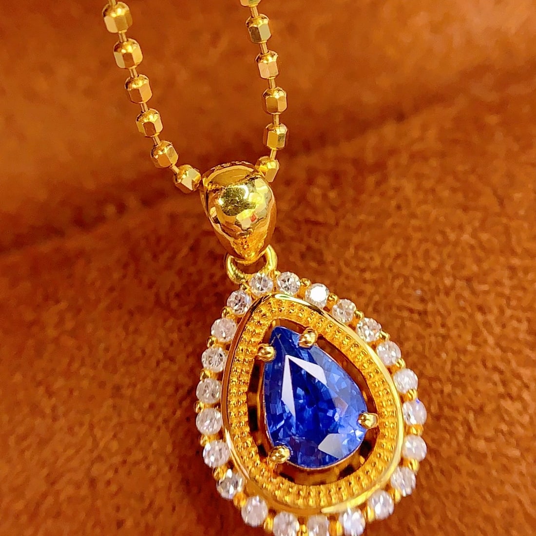 14k Gold 0.7 Ct Natural Sapphire & Diamond Pendant( Without Chain ): Ref:231106154 // gold content:14k gold // main gemstone:sapphire // shape:pear // carat weight:0. 7ct // color:blue // treatment:natural // // adjacent gemstone 2 : diamond // number of stones:22