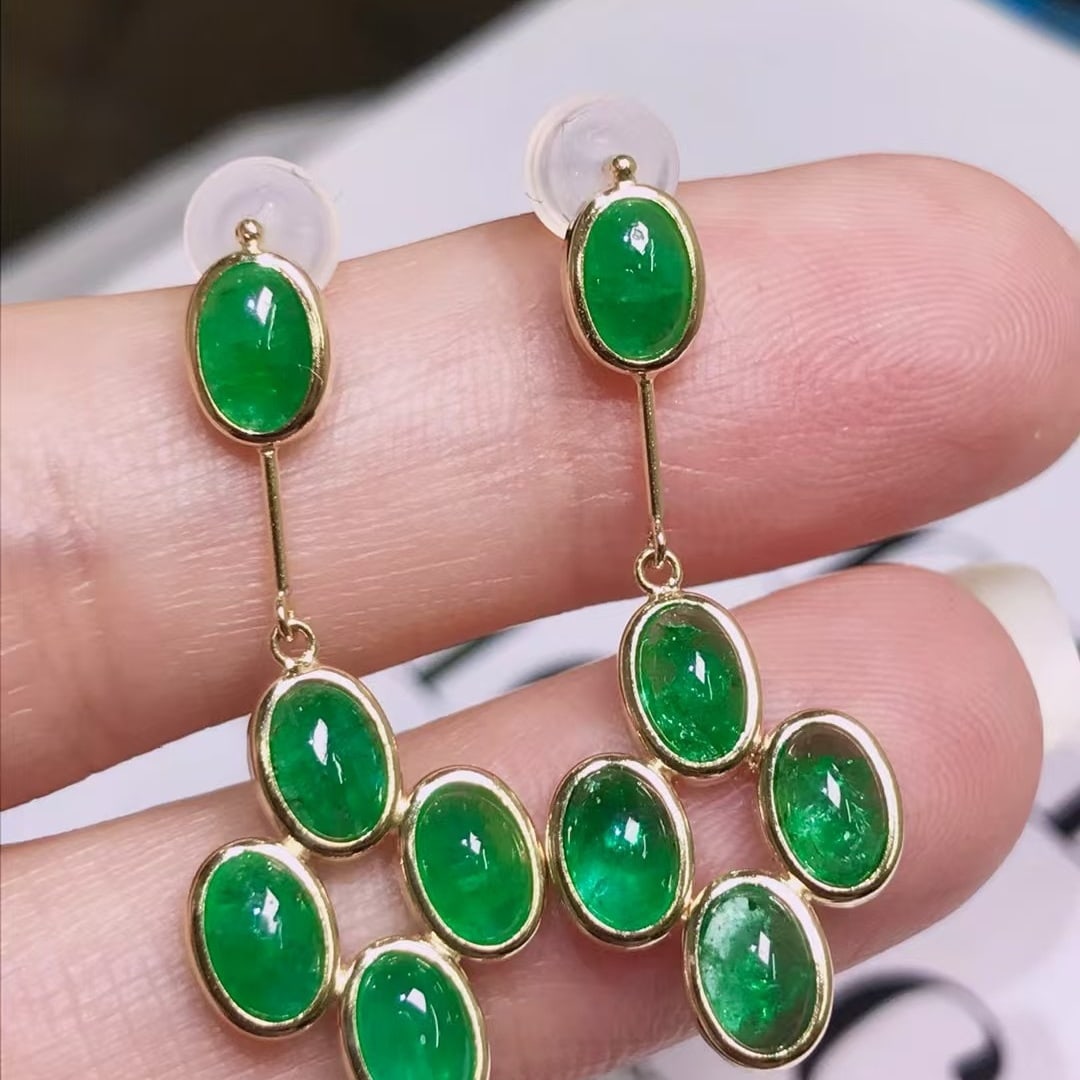 14k Gold 4.6 Ct Natural Emerald Earrings: Ref:231106189 // gold content:14k gold // main gemstone:emerald // shape:oval // carat weight:4. 6ct // color:green // treatment:natural // Condition: NewLow Estimate: 4200.00High Estimate: 6300.00
