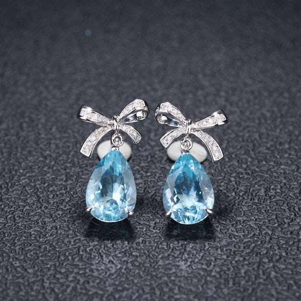 14k Gold 3.58 Ct Natural Aquamarine & Diamond Earrings: Ref:231106236 // gold content:14k gold // main gemstone:aquamarine // shape:pear // carat weight:3. 58ct // color:santa maria color // treatment:natural // // adjacent gemstone 2 : diamond //