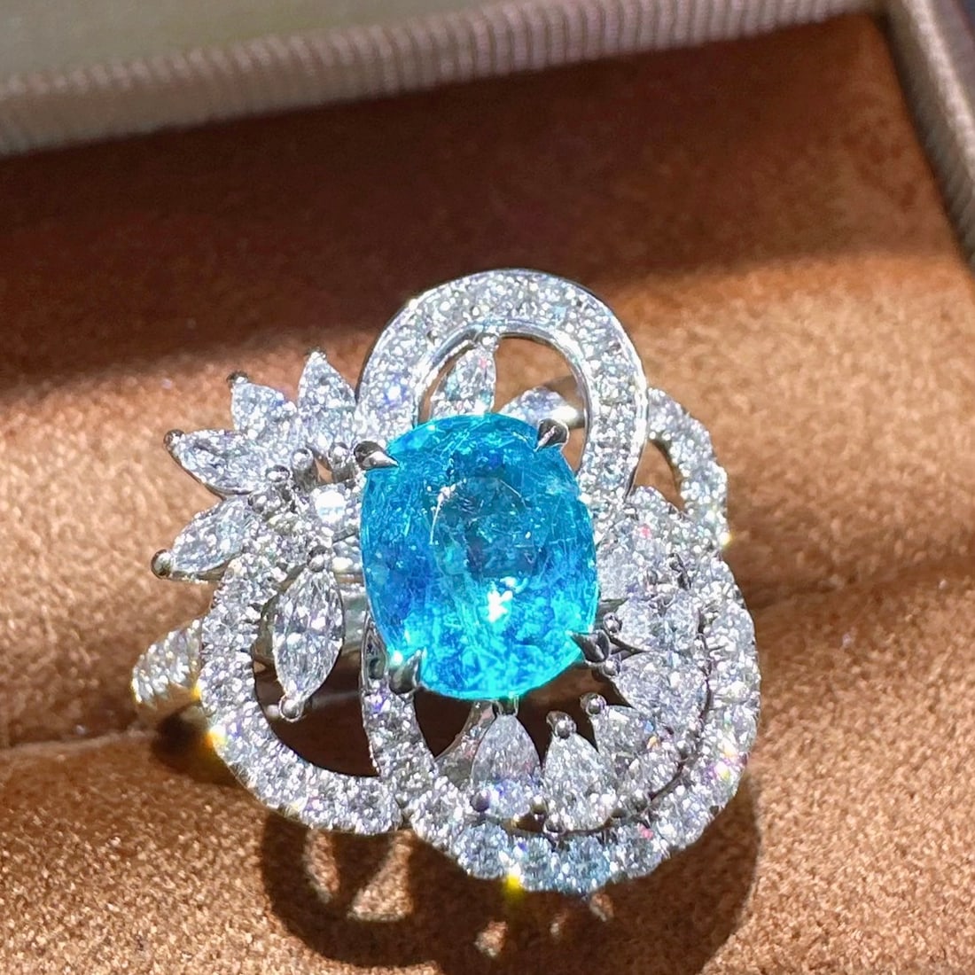 14k Gold 2.12 Ctw Natural Paraiba Tourmaline & Diamond Ring: Ref:231106264 // gold content:14k gold // ring size:7. 25us // // main gemstone:paraiba tourmaline // shape:oval // carat weight:1. 23ct // color:blue // treatment:natural // // adjacent gemstone 2 :