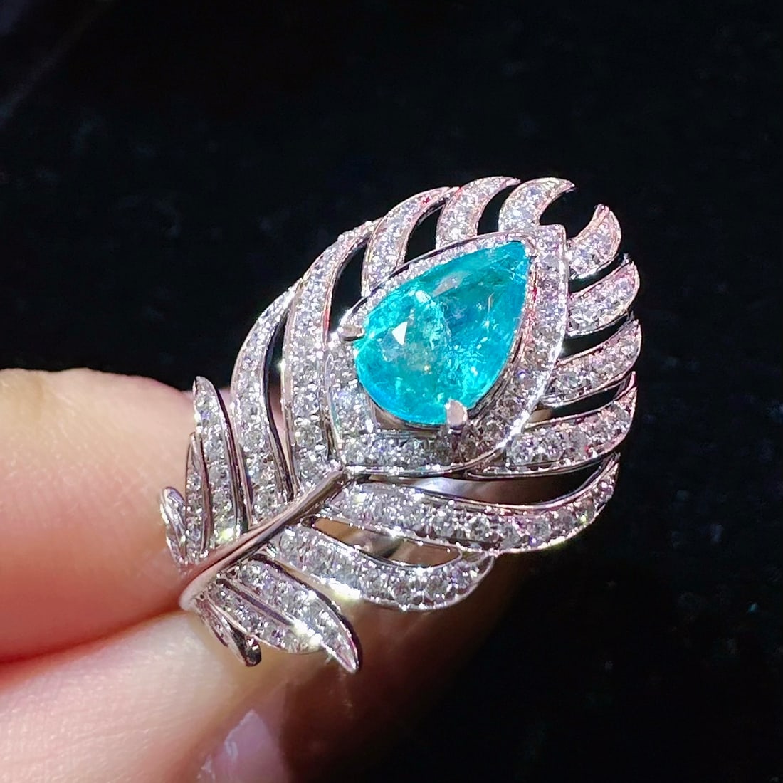 14k Gold 1.35 Ctw Natural Paraiba Tourmaline & Diamond Ring: Ref:231106326 // gold content:14k gold // ring size:7. 25us // // main gemstone:paraiba tourmaline // shape:pear // carat weight:0. 95ct // color:blue // treatment:natural // // adjacent gemstone 2 :