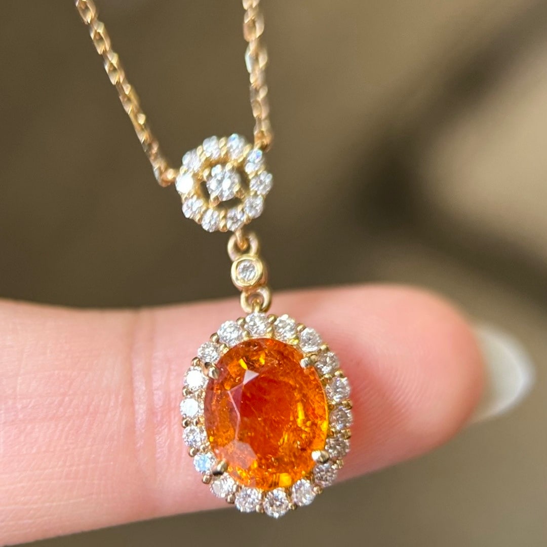 14k Gold 3.31 Ctw Natural Spessartine & Diamond Necklace: Ref:231106392 // gold content:14k gold // main gemstone:spessartine // shape:oval // carat weight:2. 90ct // color:orange // treatment:natural // // adjacent gemstone 2 : diamond // shape:round //