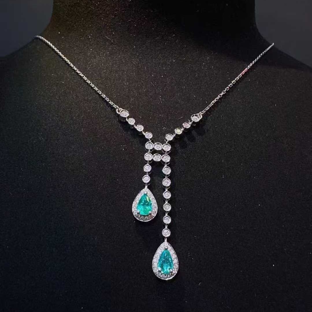 14k Gold 1.08 Ctw Natural Paraiba Tourmaline & Diamond Necklace: Ref:231115062 // gold content:14k gold // main gemstone:paraiba tourmaline // shape:pear // carat weight:0. 63ct // color:blue // treatment:natural // // adjacent gemstone 2 : diamond // shape:round /