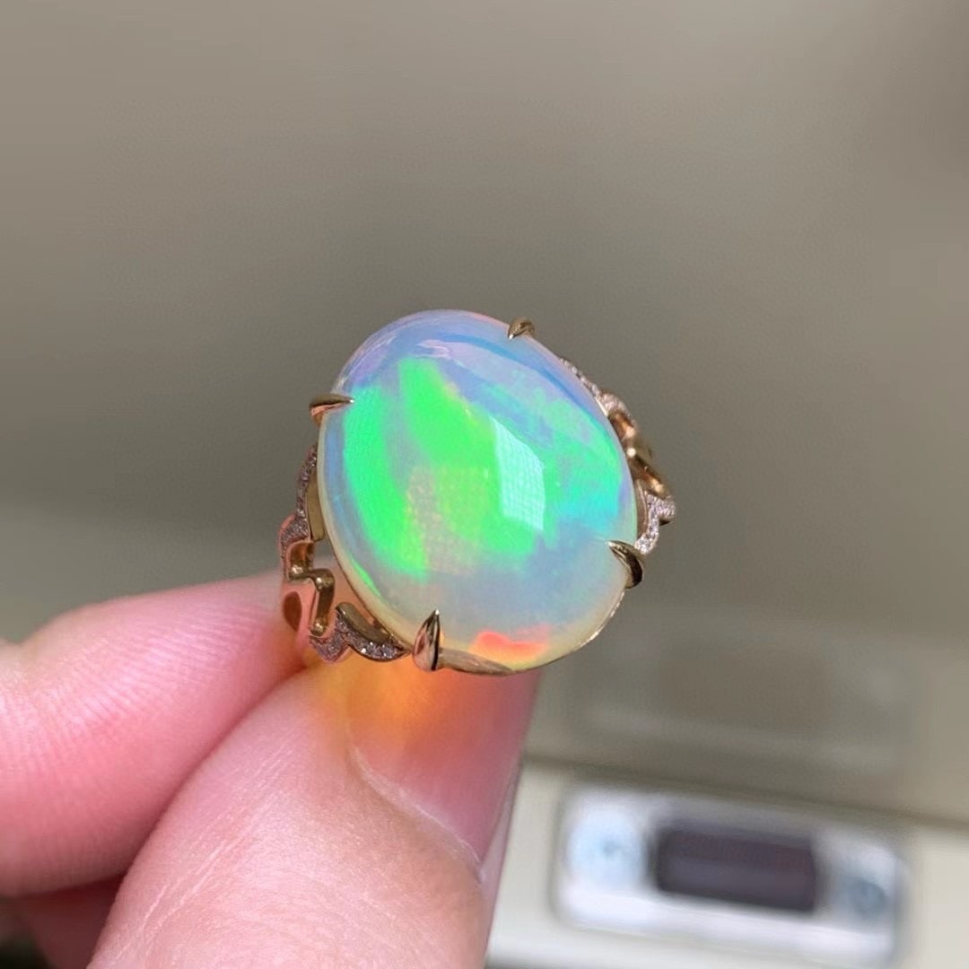 14k Gold 8.13 Ct Natural Opal & Diamond Ring: Ref:231115088 // gold content:14k gold // ring size:7. 25us // // main gemstone:opal // shape:oval // carat weight:8. 13ct // color:color // treatment:natural // // adjacent gemstone 2 : diamond