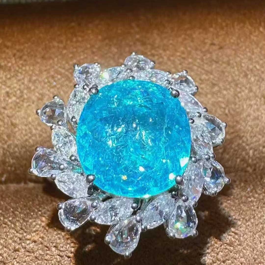 14k Gold 4.03 Ctw Natural Paraiba Tourmaline & Diamond Ring: Ref:231115159 // gold content:14k gold // ring size:7. 25us // // main gemstone:paraiba tourmaline // shape:oval // carat weight:2. 88ct // color:blue // treatment:natural // // adjacent gemstone