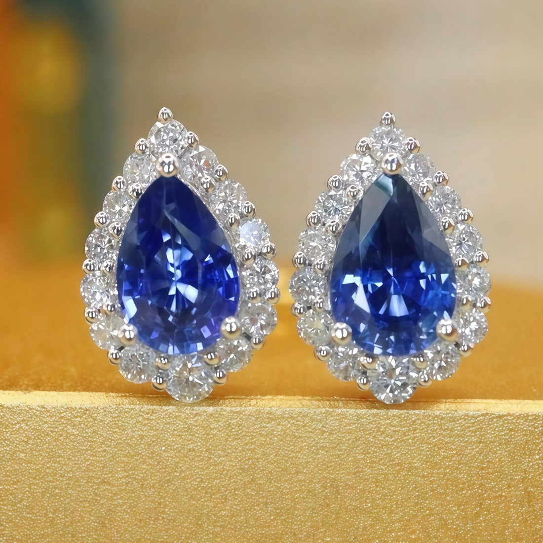 14k Gold 1.45 Ctw Natural Sapphire & Diamond Earrings: Ref:231116123 // gold content:14k gold // main gemstone:sapphire // shape:pear // carat weight:1. 15ct // color:blue // treatment:natural // // adjacent gemstone 2 : diamond // number of stones:28 //