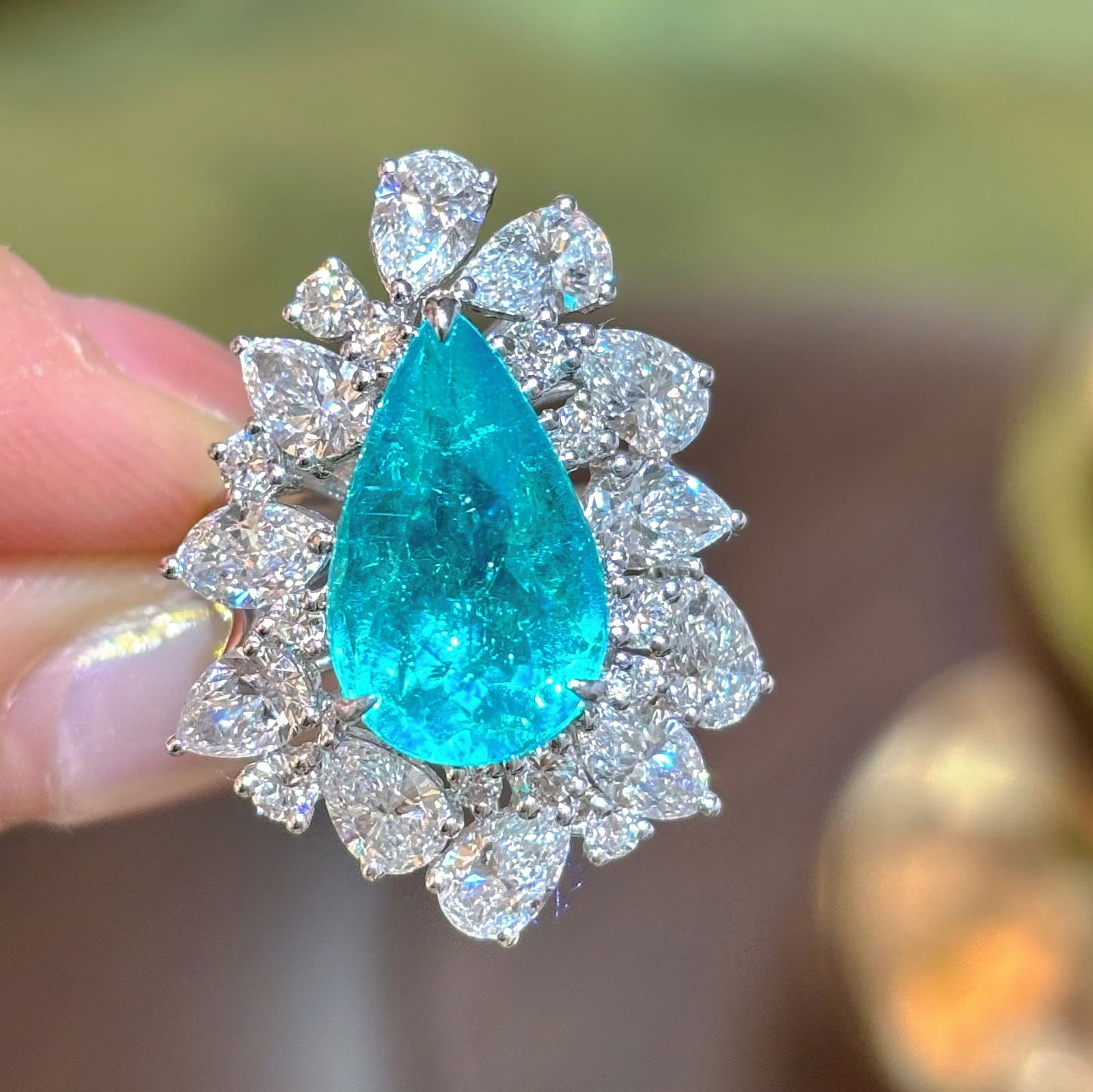 14k Gold 8.51 Ctw Natural Paraiba Tourmaline & Lab Grown Diamond Ring: Ref:231116189 // gold content:14k gold // ring size:7. 25us // // main gemstone:paraiba tourmaline // shape:pear // carat weight:5. 11ct // color:blue // treatment:natural // // adjacent gemstone